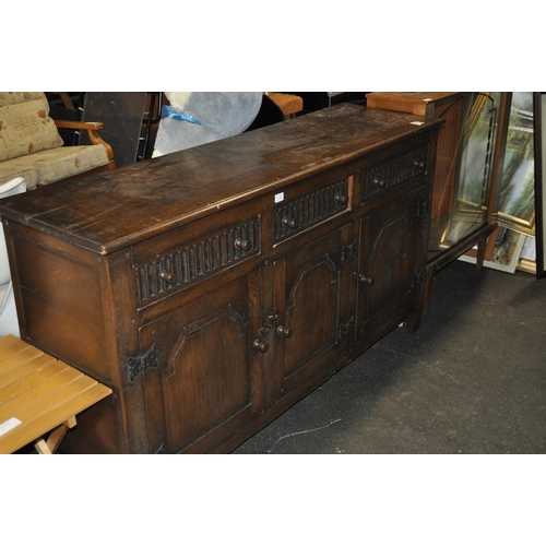 702 - CARVED SOLID OAK 3 DOOR SIDEBOARD