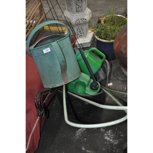 404 - GARDEN TRUG /BUCKET WITH LARGE METAL WATERING CAN , CLIMBING FRAME, SPADE AND HANGERS