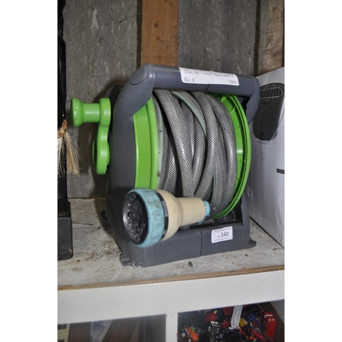 142 - HOSE ON REEL. CAN BE WALL MOUNTED