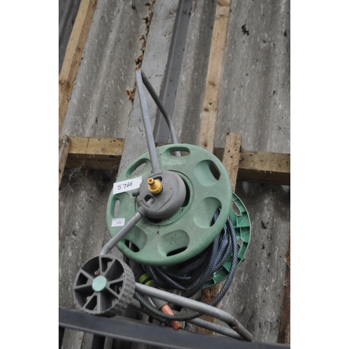 32 - GARDEN HOSE ON REEL