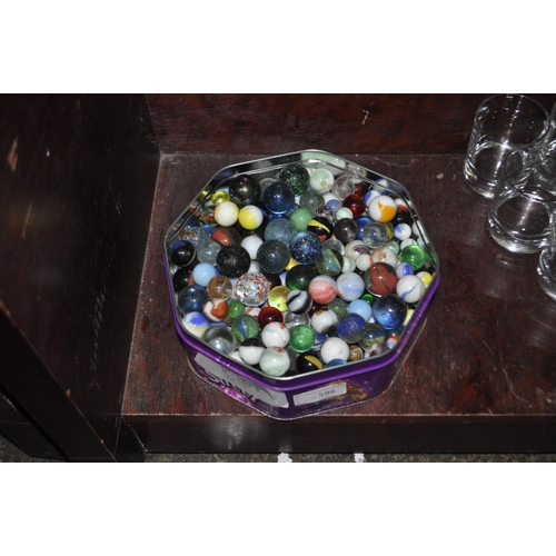 596 - LARGE TIN OF MARBLES