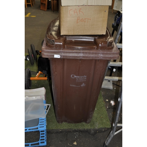 145 - LARGE BROWN WHEELY BIN TYPICALLY FOR GARDEN WASTE REMOVAL