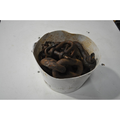 27 - BUCKET OF LARGE CAST SHACKLES AND LINKS