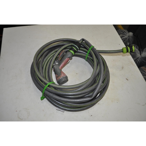 50 - GARDEN HOSE WITH ATTACHMENTS AND SPRAY HEAD