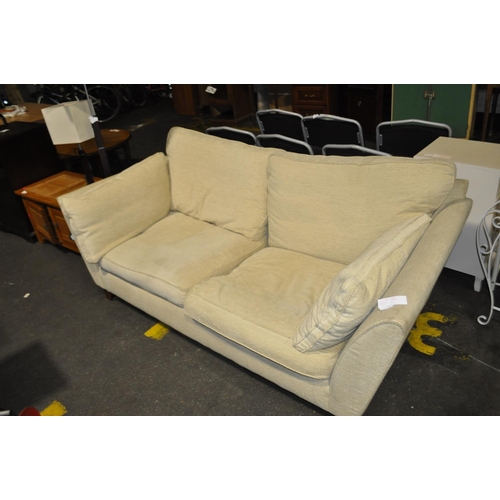 616 - 2 SEATER CREAM SOFA