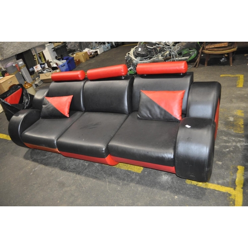 347 - RED AND BLACK 3 SEATER SOFA WITH WHEEL STYLE ARMS