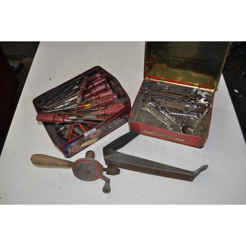 46 - TIN OF ASSORTED TOOLS INCLUDING SPANNERS, HAND DRILL, SOCKET DRIVERS