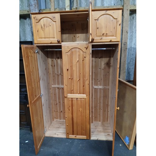 811 - 3 DOOR, PINE WARDROBE WITH 3 DOOR WARDROBE TOP CUPBOARDS
SECTIONAL FOR TRANSPORT
130 X 215 X 53