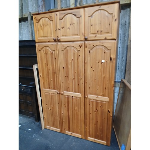 811 - 3 DOOR, PINE WARDROBE WITH 3 DOOR WARDROBE TOP CUPBOARDS
SECTIONAL FOR TRANSPORT
130 X 215 X 53