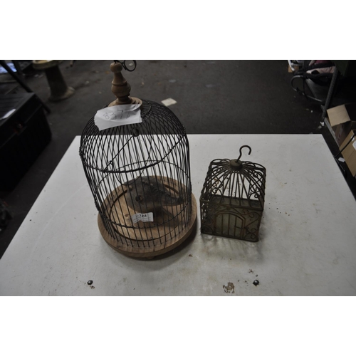 124 - A PAIR OF BIRD CAGES, ONE CONTAINING A VERY RARE PUFFER-FISHUS FLIGHTLESS BIRD (TAXIDERMY EXHIBIT