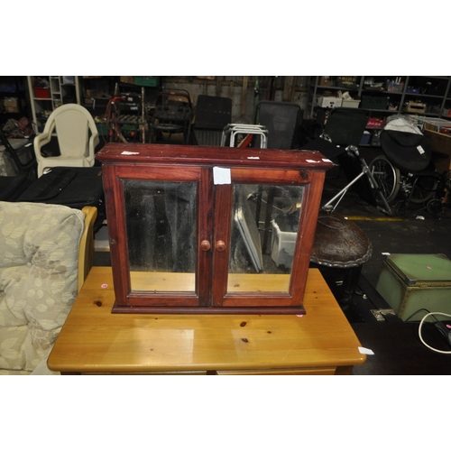 854 - A MODERN STAINED PINE TWO DOOR MEDICINE CABINET