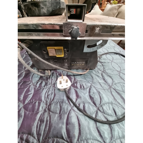 68 - Handy Power Nutool England FHPT180 Electric Tabletop Tile CutterAn electric tabletop tile cutter m... 
