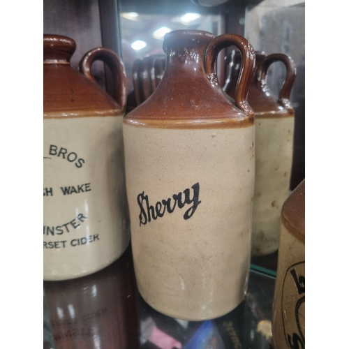 An Assortment of West Country Advertising Stoneware Flagons This lot ...