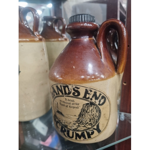 An Assortment of West Country Advertising Stoneware Flagons This lot ...