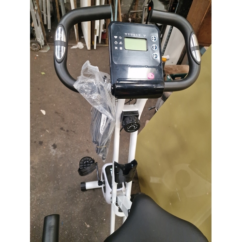 100 - A Bagzzia Folding Stationary Exercise BikeA Bagzzia folding stationary exercise bike featuring a w... 