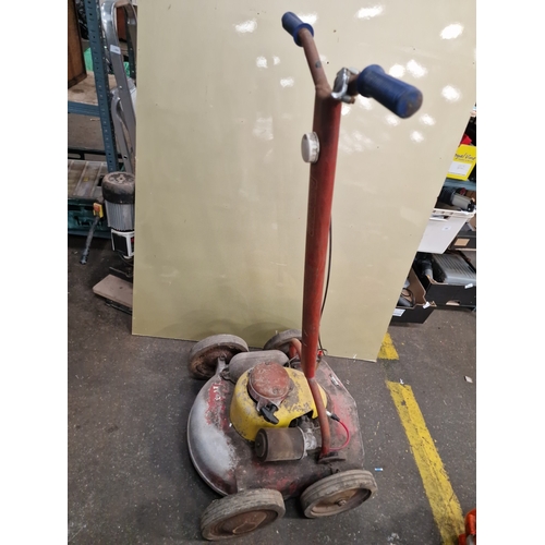 110 - A Vintage Petrol-Powered Rotary LawnmowerThis vintage petrol-powered rotary lawnmower is of mid-20... 