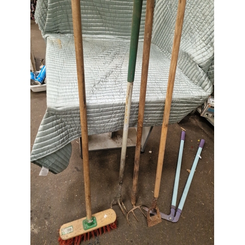 61 - An Assortment of Vintage and Contemporary Garden and Utility ToolsA collection of various garden a... 