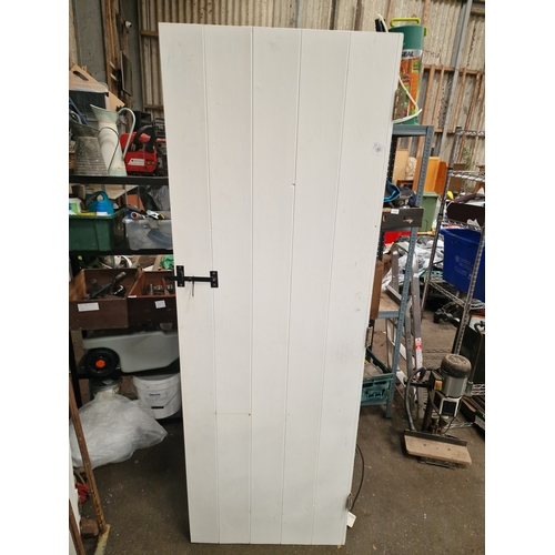 62 - A Pair of Reclaimed White-Painted Timber Ledged and Braced DoorsA matching pair of reclaimed timbe... 
