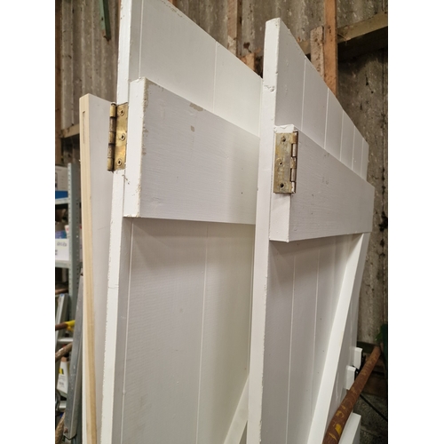 62 - A Pair of Reclaimed White-Painted Timber Ledged and Braced DoorsA matching pair of reclaimed timbe... 