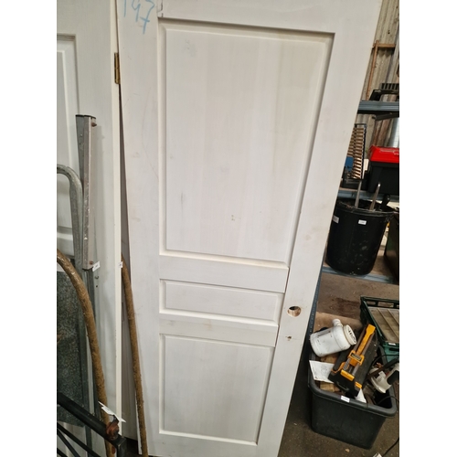63 - A Group of Solid Softwood Three-Panel Internal DoorsA collection of solid timber internal doors pr... 
