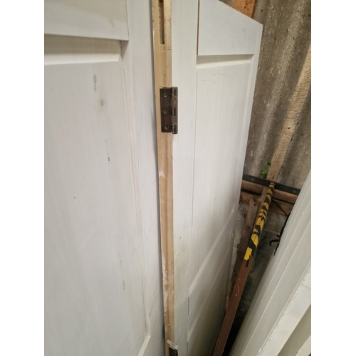 63 - A Group of Solid Softwood Three-Panel Internal DoorsA collection of solid timber internal doors pr... 