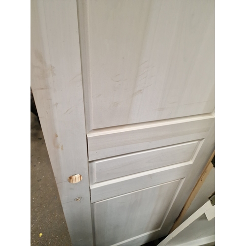 63 - A Group of Solid Softwood Three-Panel Internal DoorsA collection of solid timber internal doors pr... 