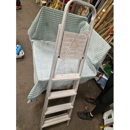 66 - An Aluminium Four-Step Folding Step LadderA folding step ladder manufactured from aluminium. The l... 