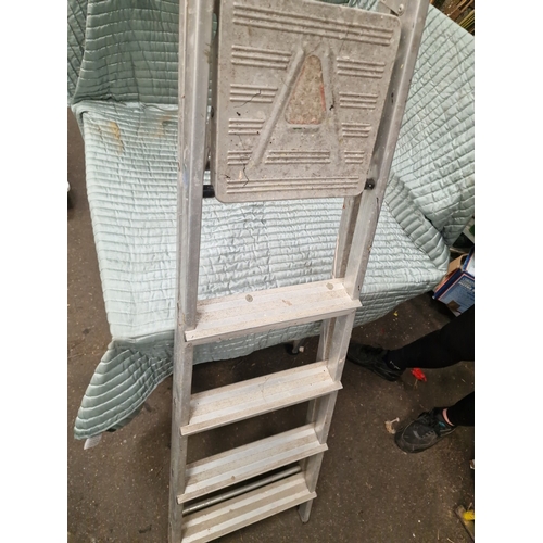 66 - An Aluminium Four-Step Folding Step LadderA folding step ladder manufactured from aluminium. The l... 