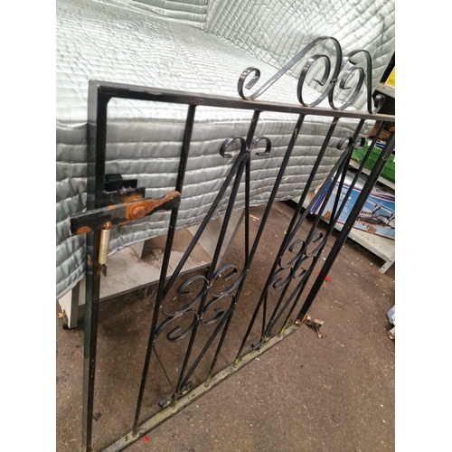 67 - A Decorative Wrought Iron Style Garden Gate with Scrollwork PanelsA single metal pedestrian garden... 