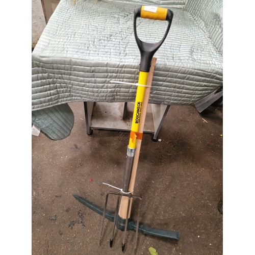 69 - Two Ground-Working Tools including a Roughneck Digging Fork and a Faithfull PickaxeThis lot compri... 