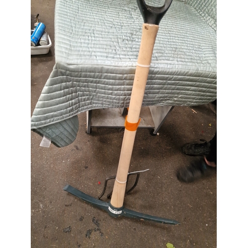 69 - Two Ground-Working Tools including a Roughneck Digging Fork and a Faithfull PickaxeThis lot compri... 