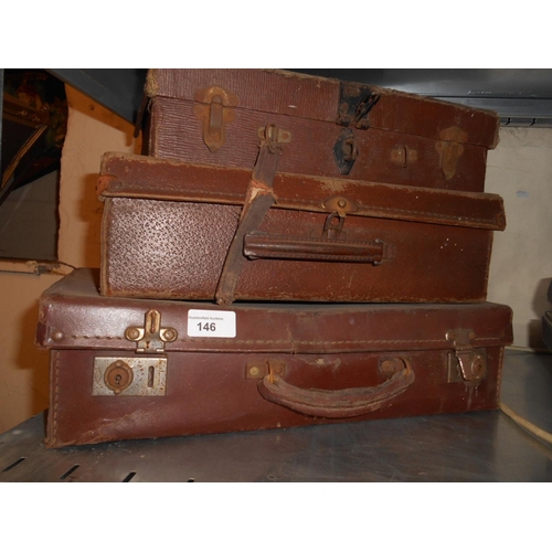 146 - 3 old leather suitcases