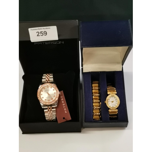 259 - Boxed mens and ladys watches