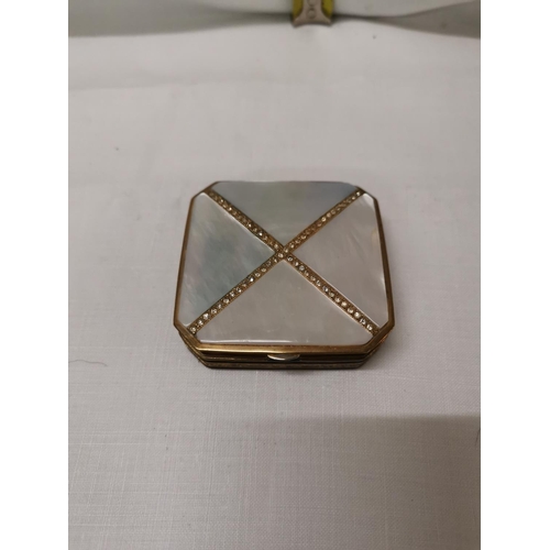 298 - Mother of pearl Diamante cross powder compact