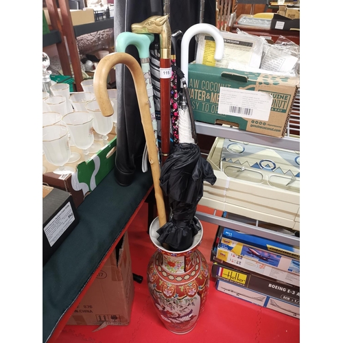 115 - Chinese vase and walking sticks etc