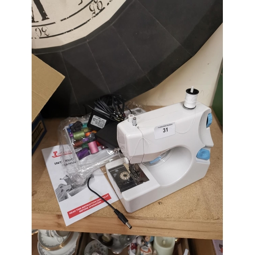 31 - Small sewing machine- as new