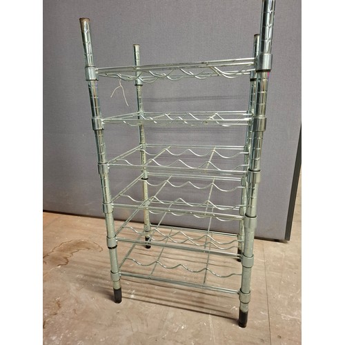 33 - Metal wine rack stand.Holds 24 bottles. Good condition