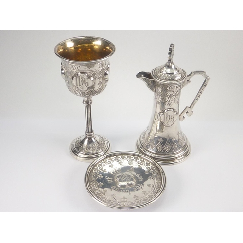 23 - Victorian silver portable communion set engraved and applied with bosses, chalice, paten and ewer of... 