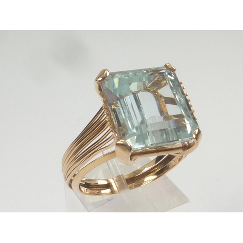 27 - Aquamarine dress ring in gold multiple wire mount. Size 'S'.