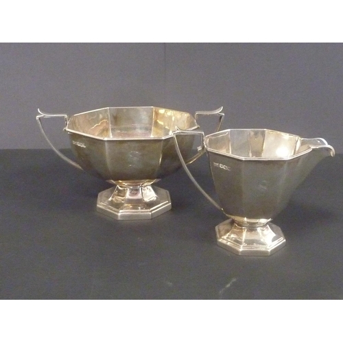 3 - Silver three-piece tea set of octagonal shape, initialled, by Walker & Hall, Sheffield 1937.