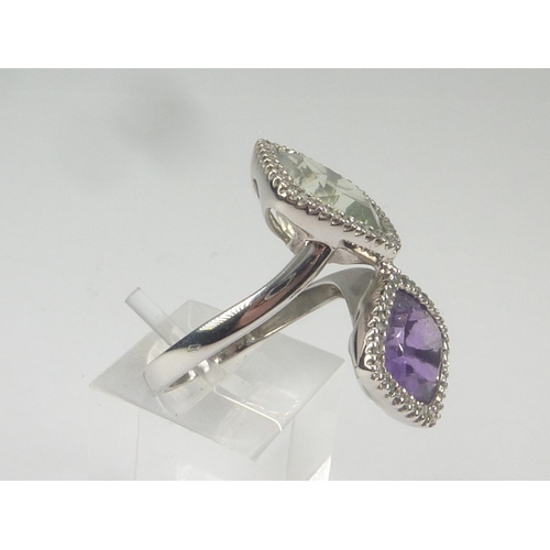 38 - Cross over ring with amethyst and pale aventurine quartz collets, each with tiny diamonds, in sizes,... 