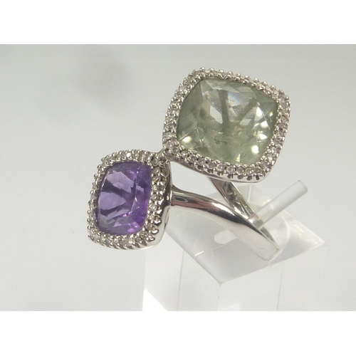 38 - Cross over ring with amethyst and pale aventurine quartz collets, each with tiny diamonds, in sizes,... 