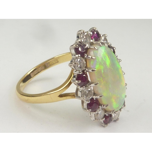 39 - Cluster ring with oval opal surrounded by diamonds and rubies alternating, 18ct gold. Size 'P'. ... 