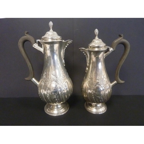 4 - Pair of silver cafe au lait pots of Georgian style, embossed pear shape, by Thomas Bradbury, 1897/8.