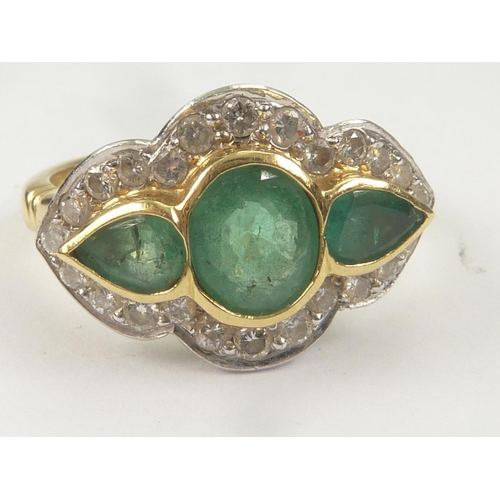 41 - Three stone ring with an oval emerald flanked by two other of pear shape surrounded by diamonds in 1... 