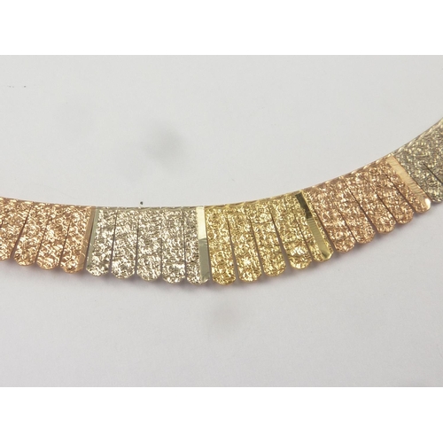 43 - Necklace of coloured gold panels, graduated, '750'.