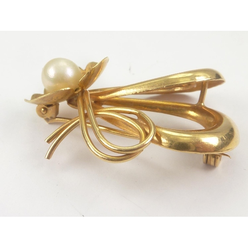 51 - Gold brooch with three loops and cultured pearl set leaf, '750'.