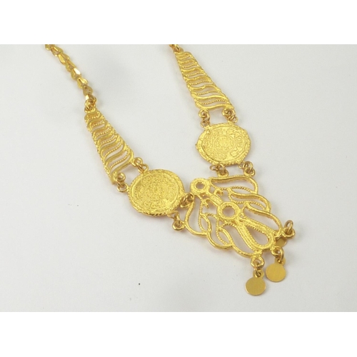 57 - Middle Eastern gold necklace with discs and drops, probably 22ct.