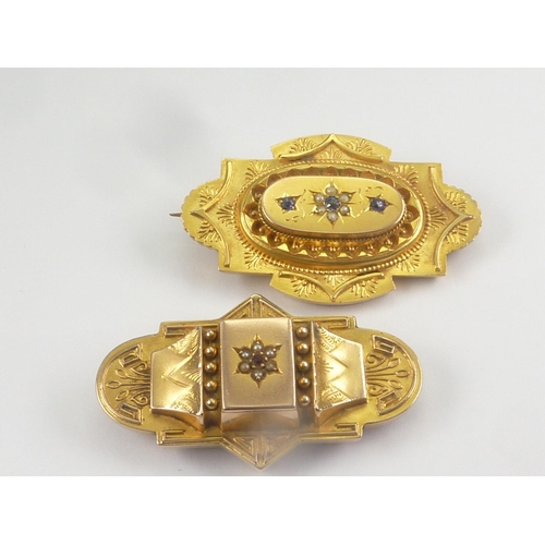 65 - Two Victorian embossed brooches, gem set. 