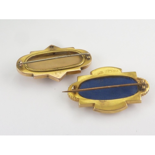 65 - Two Victorian embossed brooches, gem set. 